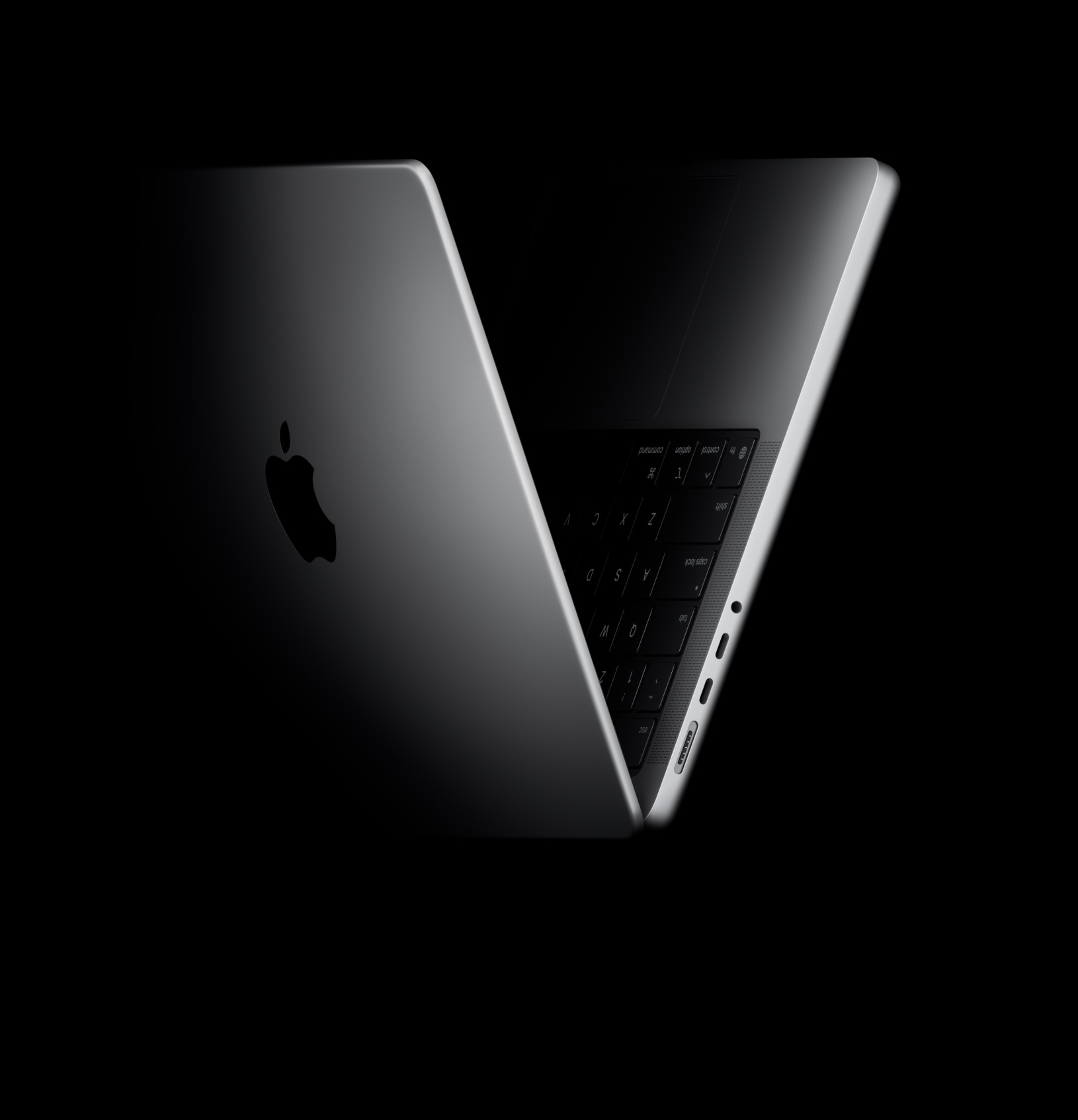 MacBook Pro on a dark background